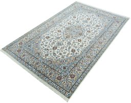Corner detail of New Kashan rug showing border pattern and Cork pile