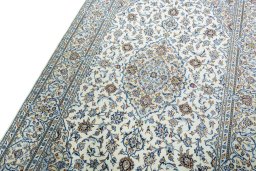 Backside of handmade New Kashan rug showing knot structure and weave density