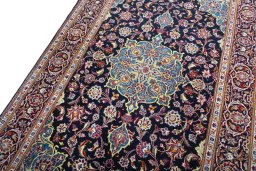 Backside of handmade New Kashan rug showing knot structure and weave density