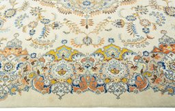 Corner detail of 1970s Kashan rug showing border pattern and Wool pile