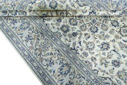 Close-up detail of 2000s Kashan rug from Iran / Persia showing Wool weave
