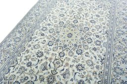 Backside of handmade 2000s Kashan rug showing knot structure and weave density