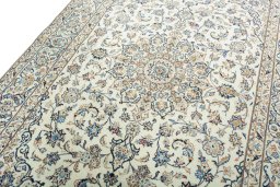 Backside of handmade New Kashan rug showing knot structure and weave density