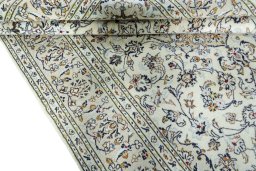 Close-up detail of 2000s Kashan rug from Iran / Persia showing Wool weave