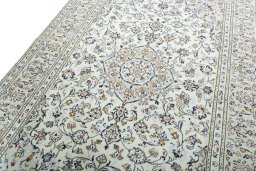 Backside of handmade 2000s Kashan rug showing knot structure and weave density