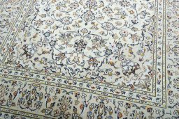 Close-up detail of 2000s Kashan rug from Iran / Persia showing Wool weave