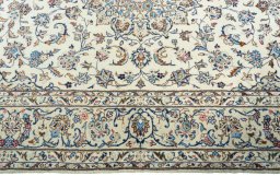 Corner detail of New Kashan rug showing border pattern and Wool pile