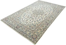 Corner detail of New Kashan rug showing border pattern and Wool pile