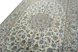 Backside of handmade New Kashan rug showing knot structure and weave density