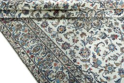 Close-up detail of 2000s Kashan rug from Iran / Persia showing Wool weave