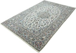 Corner detail of 2000s Kashan rug showing border pattern and Wool pile