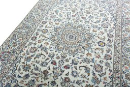 Backside of handmade 2000s Kashan rug showing knot structure and weave density