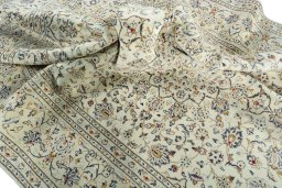 Surface texture of 2000s Kashan rug with natural Wool and intricate pattern