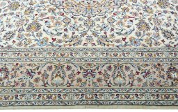 Corner detail of New Kashan rug showing border pattern and Wool pile