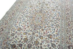 Backside of handmade New Kashan rug showing knot structure and weave density