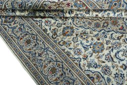 Close-up detail of 2000s Kashan rug from Iran / Persia showing Wool weave