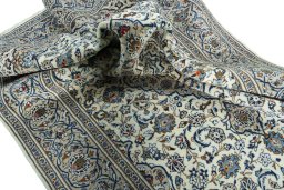 Surface texture of 2000s Kashan rug with natural Wool and intricate pattern