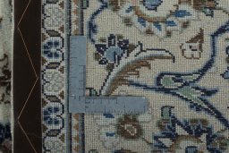 Backside of handmade New Kashan rug showing knot structure and weave density