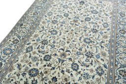 Backside of handmade New Kashan rug showing knot structure and weave density