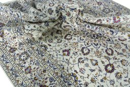Surface texture of 2000s Kashan rug with natural Wool and intricate pattern