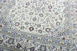 Close-up detail of 2000s Kashan rug from Iran / Persia showing Wool weave