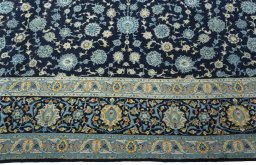 Corner detail of 1970s Kashan rug showing border pattern and Wool pile