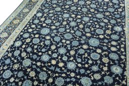 Backside of handmade 1970s Kashan rug showing knot structure and weave density
