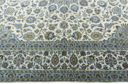 Corner detail of New Kashan rug showing border pattern and Cork pile