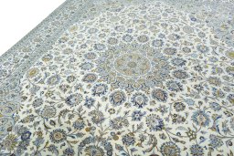 Backside of handmade New Kashan rug showing knot structure and weave density