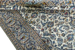 Close-up detail of 2000s Kashan rug from Iran / Persia showing Wool weave