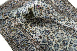 Surface texture of 2000s Kashan rug with natural Wool and intricate pattern
