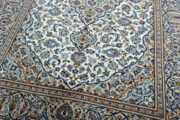 Close-up detail of 2000s Kashan rug from Iran / Persia showing Wool weave