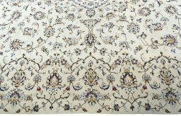 Corner detail of New Kashan rug showing border pattern and Wool pile