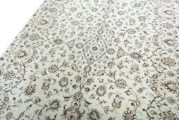 Backside of handmade New Kashan rug showing knot structure and weave density