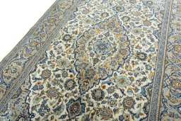 Backside of handmade 2000s Kashan rug showing knot structure and weave density