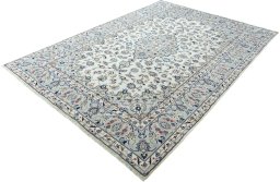 Corner detail of 2000s Kashan rug showing border pattern and Wool pile
