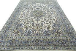 Surface texture of 2000s Kashan rug with natural Cork and intricate pattern