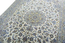 Backside of handmade 2000s Kashan rug showing knot structure and weave density