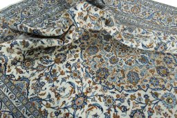 Surface texture of 2000s Kashan rug with natural Wool and intricate pattern