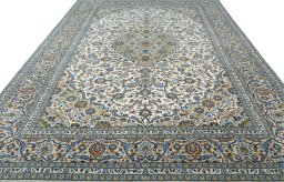 Surface texture of 2000s Kashan rug with natural Wool and intricate pattern