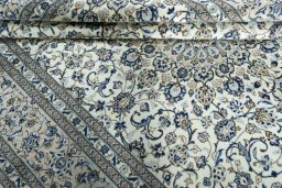 Close-up detail of 2000s Kashan rug from Iran / Persia showing Wool weave