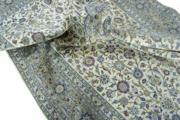 Surface texture of 2000s Kashan rug with natural Cork and intricate pattern