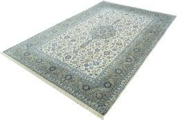 Corner detail of 2000s Kashan rug showing border pattern and Cork pile