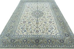 Surface texture of 2000s Kashan rug with natural Cork and intricate pattern