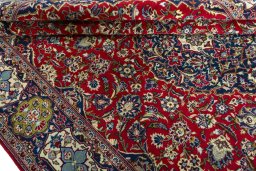 Close-up detail of 2000s Kashan rug from Iran / Persia showing Wool weave