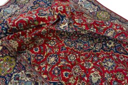Surface texture of 2000s Kashan rug with natural Wool and intricate pattern