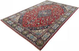 Corner detail of 2000s Kashan rug showing border pattern and Wool pile