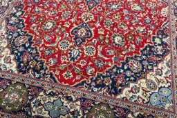 Close-up detail of 2000s Kashan rug from Iran / Persia showing Wool weave