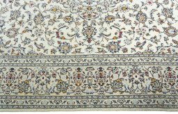 Corner detail of New Kashan rug showing border pattern and Wool pile