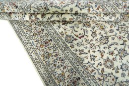Close-up detail of New Kashan rug from Iran / Persia showing Wool weave